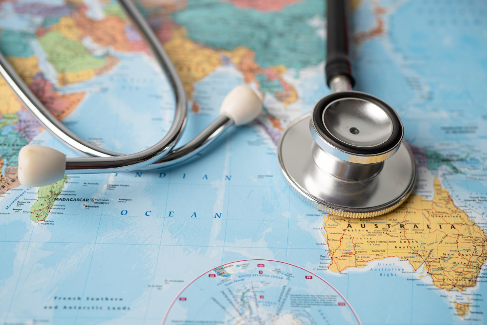 Stethoscope resting on a world map, representing treatment coordinated across countries